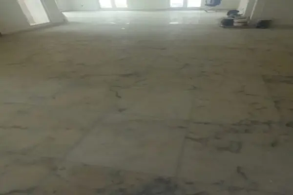 Before marble crystallization in a DIFC office showing a faded and dull marble floor